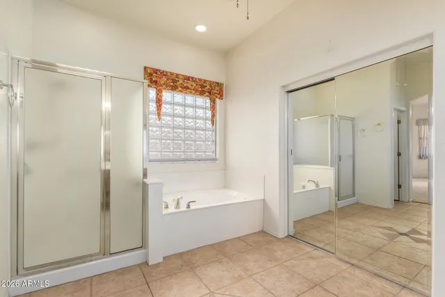 a bathroom with a bathtub and a shower