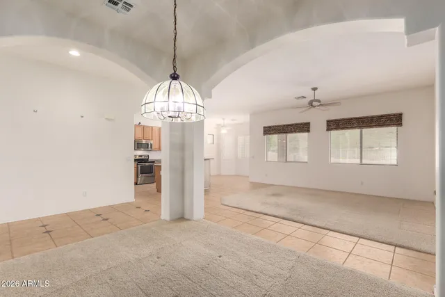 a view of a room with wooden floor and windows