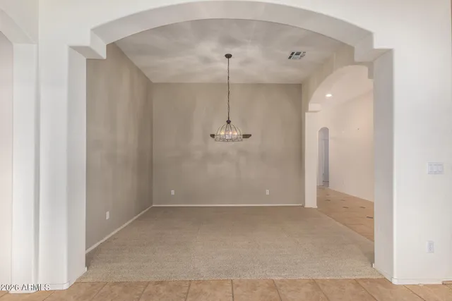 an empty room with a shower