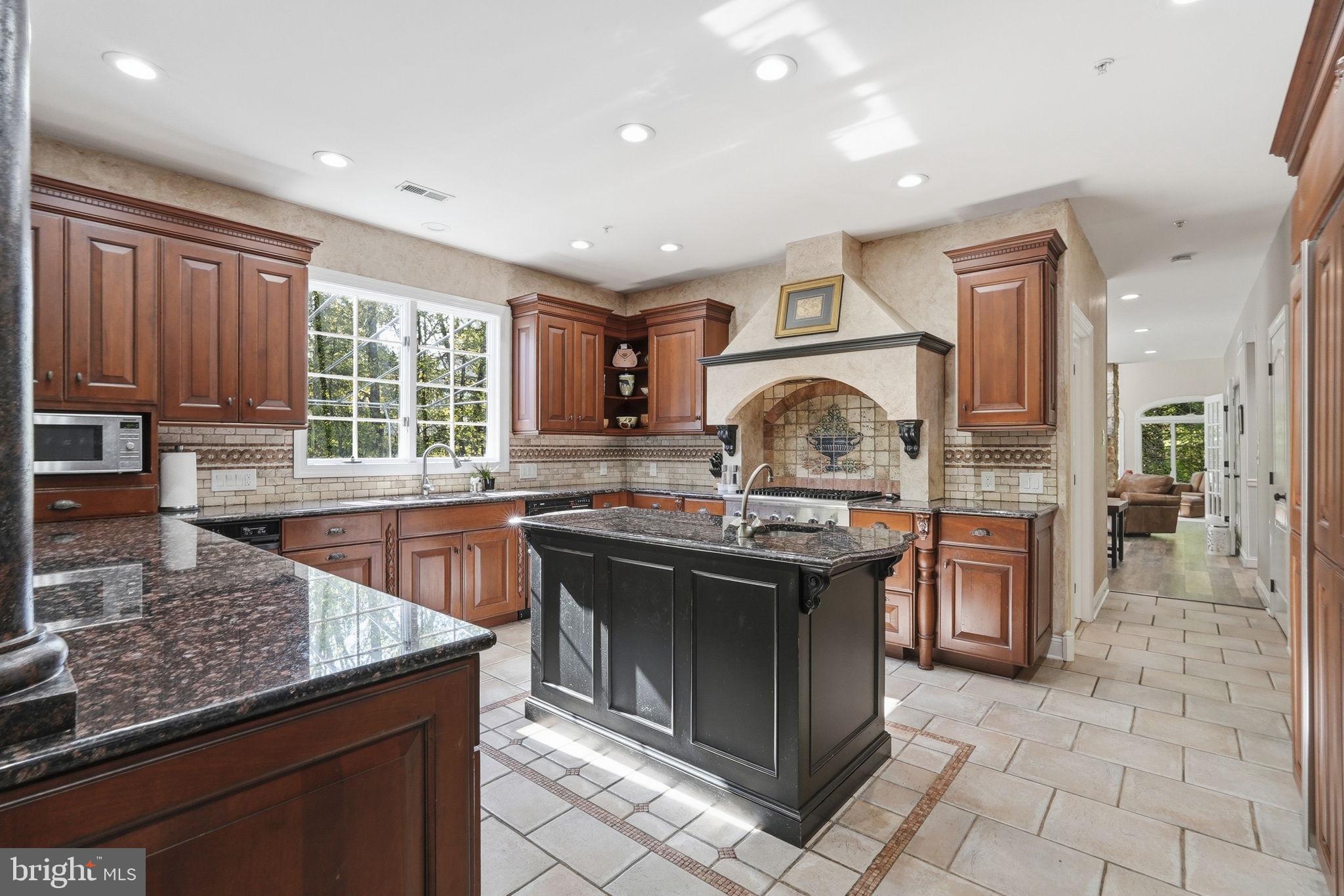 195 Carnoustie Way Media, PA 19063 - Photo 18 of 78 Elegant kitchen with rich wood accents.