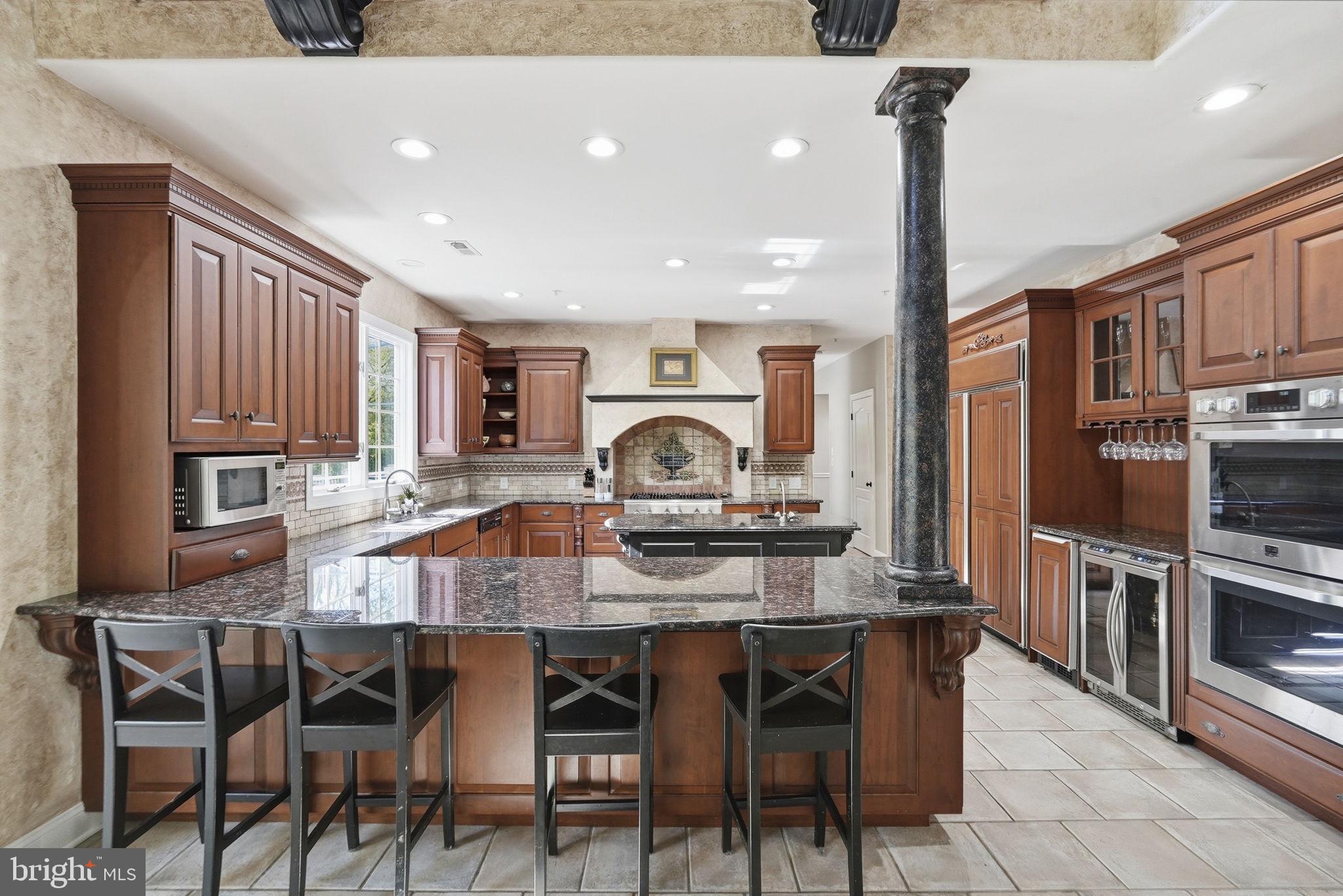 195 Carnoustie Way Media, PA 19063 - Photo 26 of 78 Elegant kitchen with rich cabinetry.