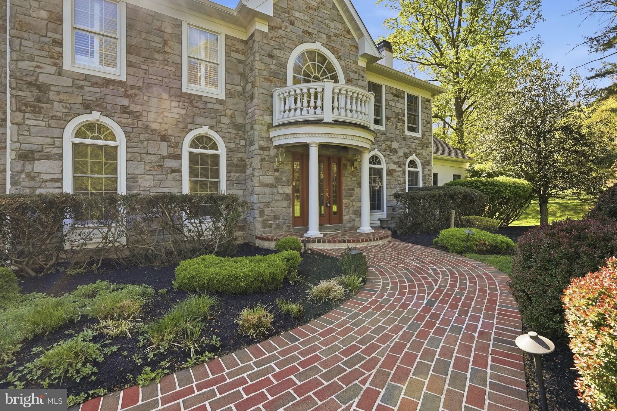 195 Carnoustie Way Media, PA 19063 - Photo 3 of 78 Elegant stone facade with lush landscaping.