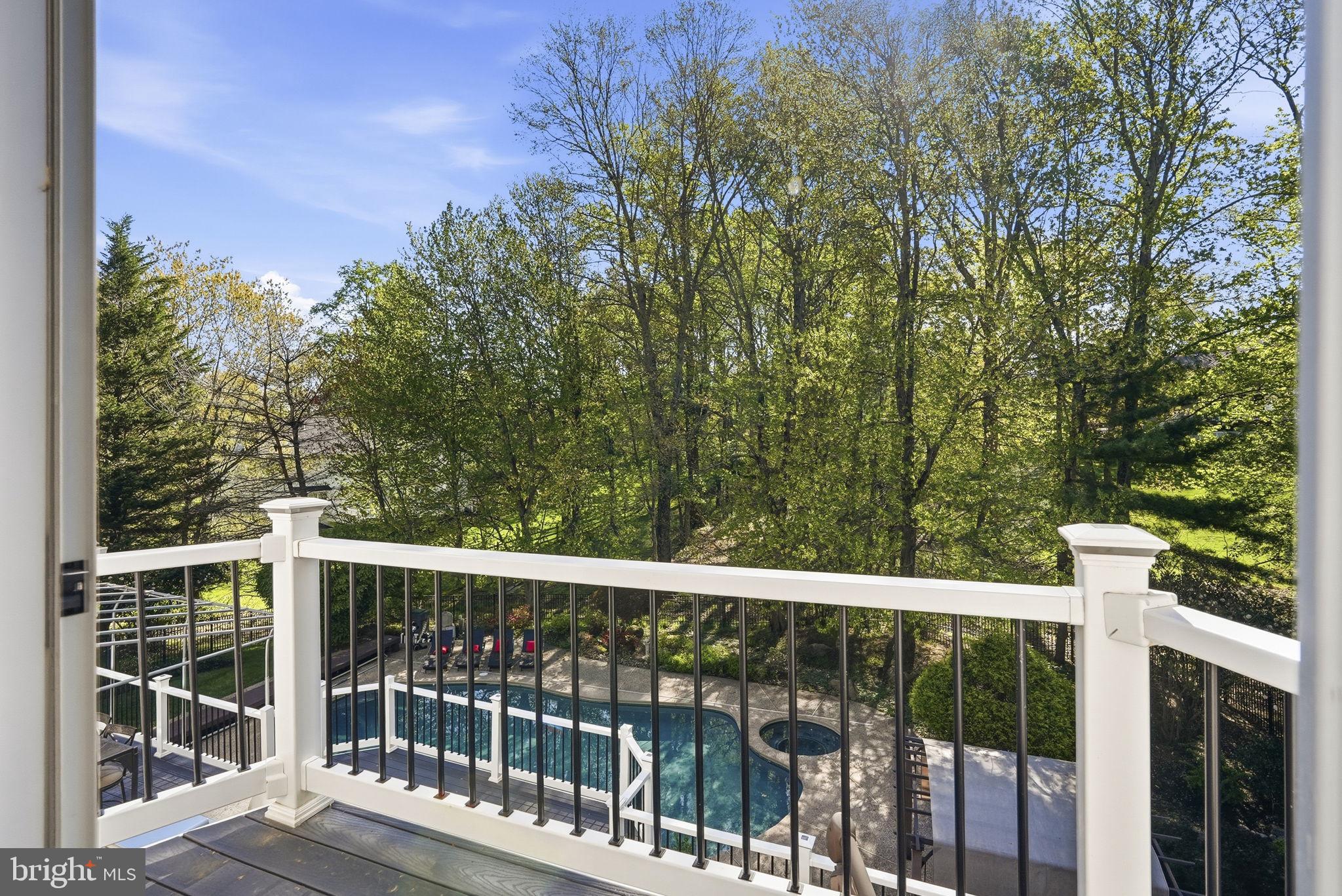 195 Carnoustie Way Media, PA 19063 - Photo 45 of 78 Serene view of lush greenery and pool.