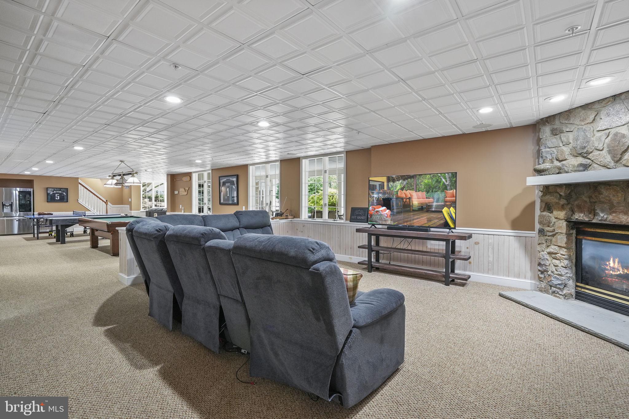 195 Carnoustie Way Media, PA 19063 - Photo 66 of 78 Spacious basement retreat with fireplace.