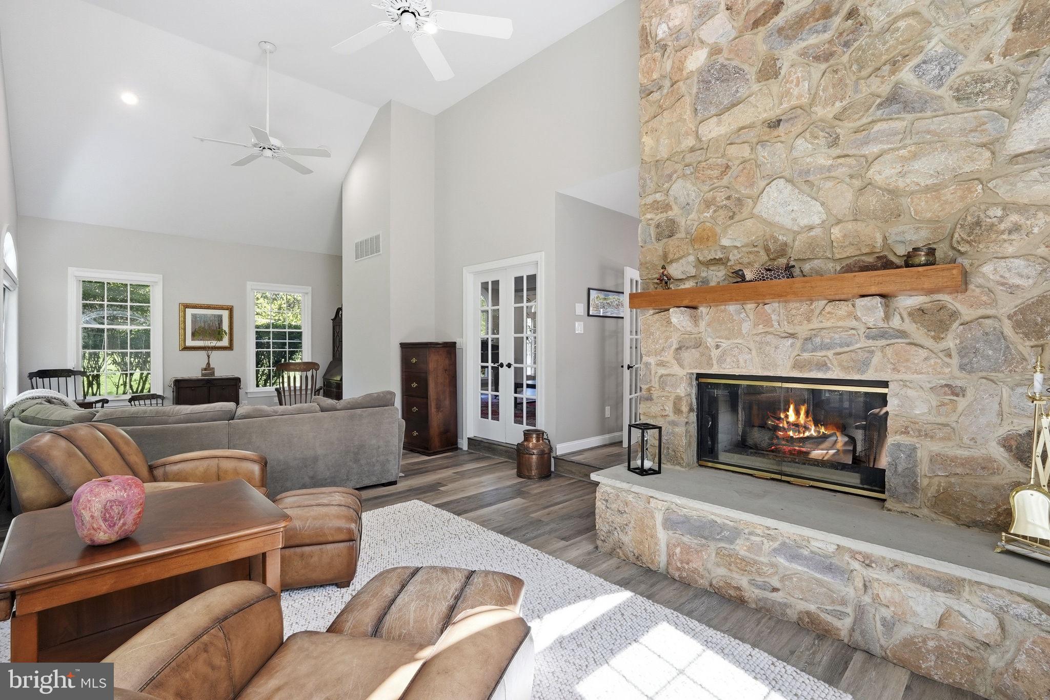 195 Carnoustie Way Media, PA 19063 - Photo 77 of 78 Cozy living space with stone fireplace.