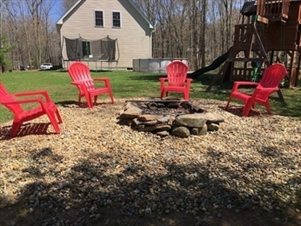 1230 Bemis Road Warren, MA 01083 - Photo 15 of 17 a view of backyard with wooden fence and trees