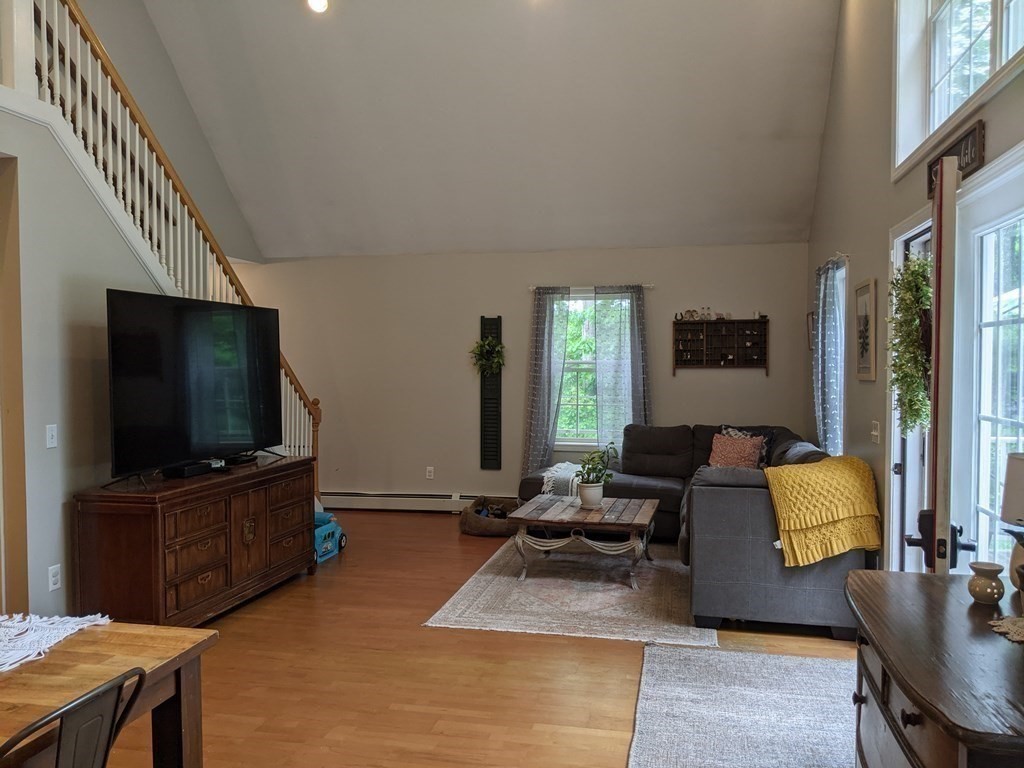 1230 Bemis Road Warren, MA 01083 - Photo 8 of 17 a living room with furniture and a flat screen tv