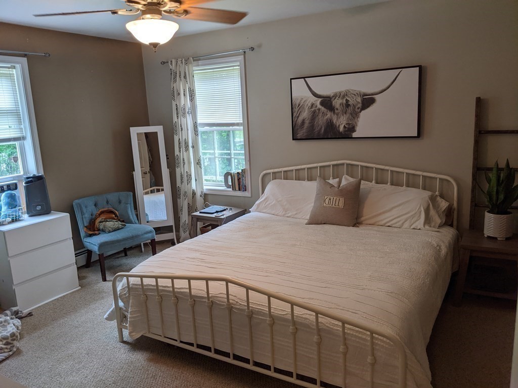 1230 Bemis Road Warren, MA 01083 - Photo 9 of 17 a bedroom with a bed a couch and a window