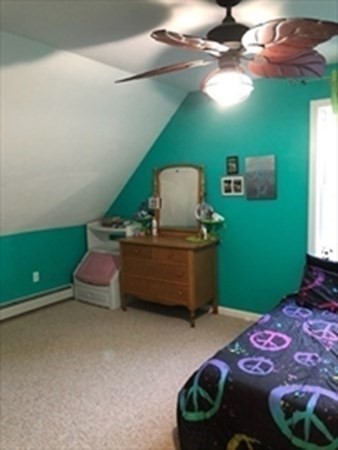 1230 Bemis Road Warren, MA 01083 - Photo 10 of 17 a bedroom with a bed and a chandelier