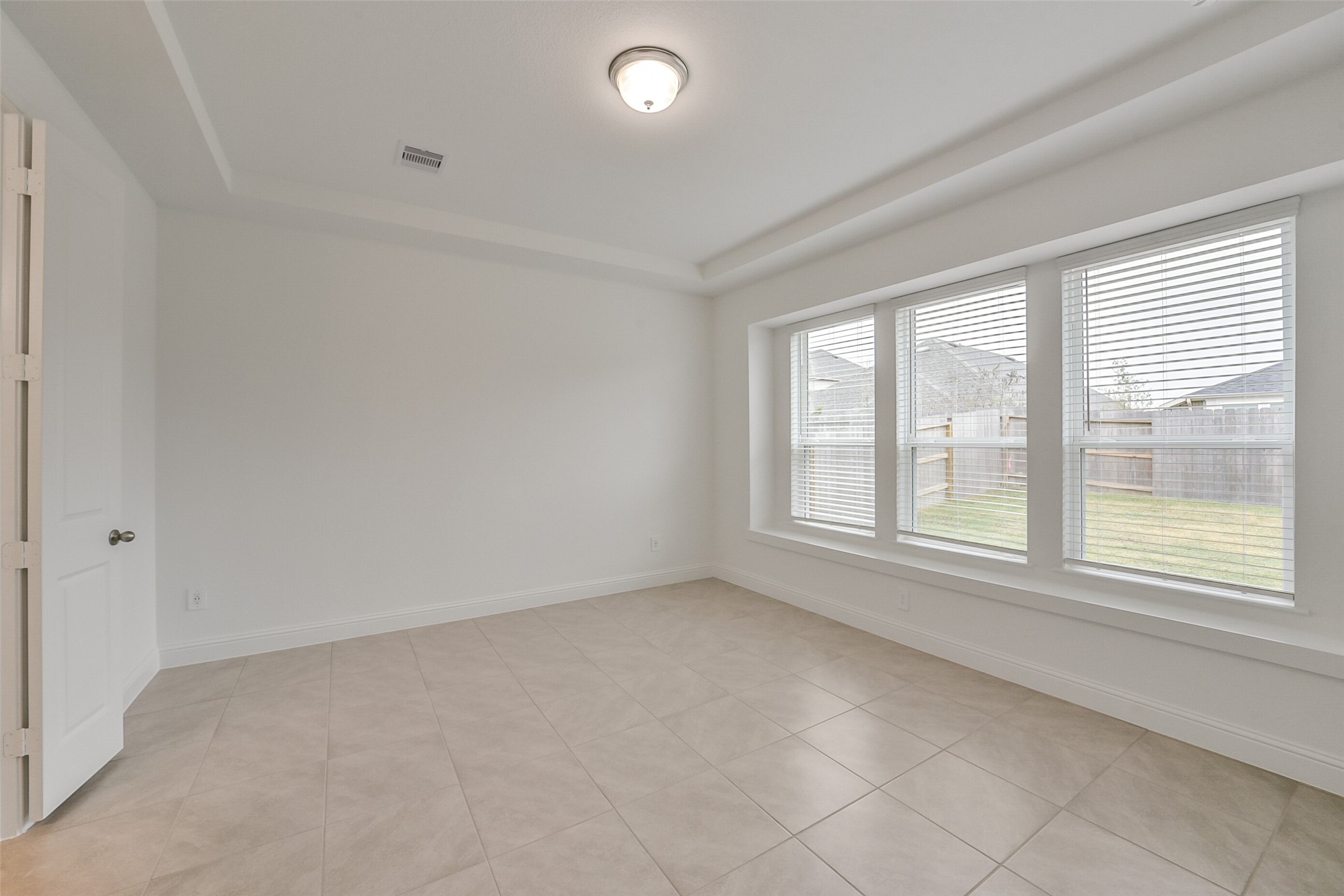 16018 Tangled Vine Lane Conroe, TX 77302 - Photo 20 of 41 an empty room with a window