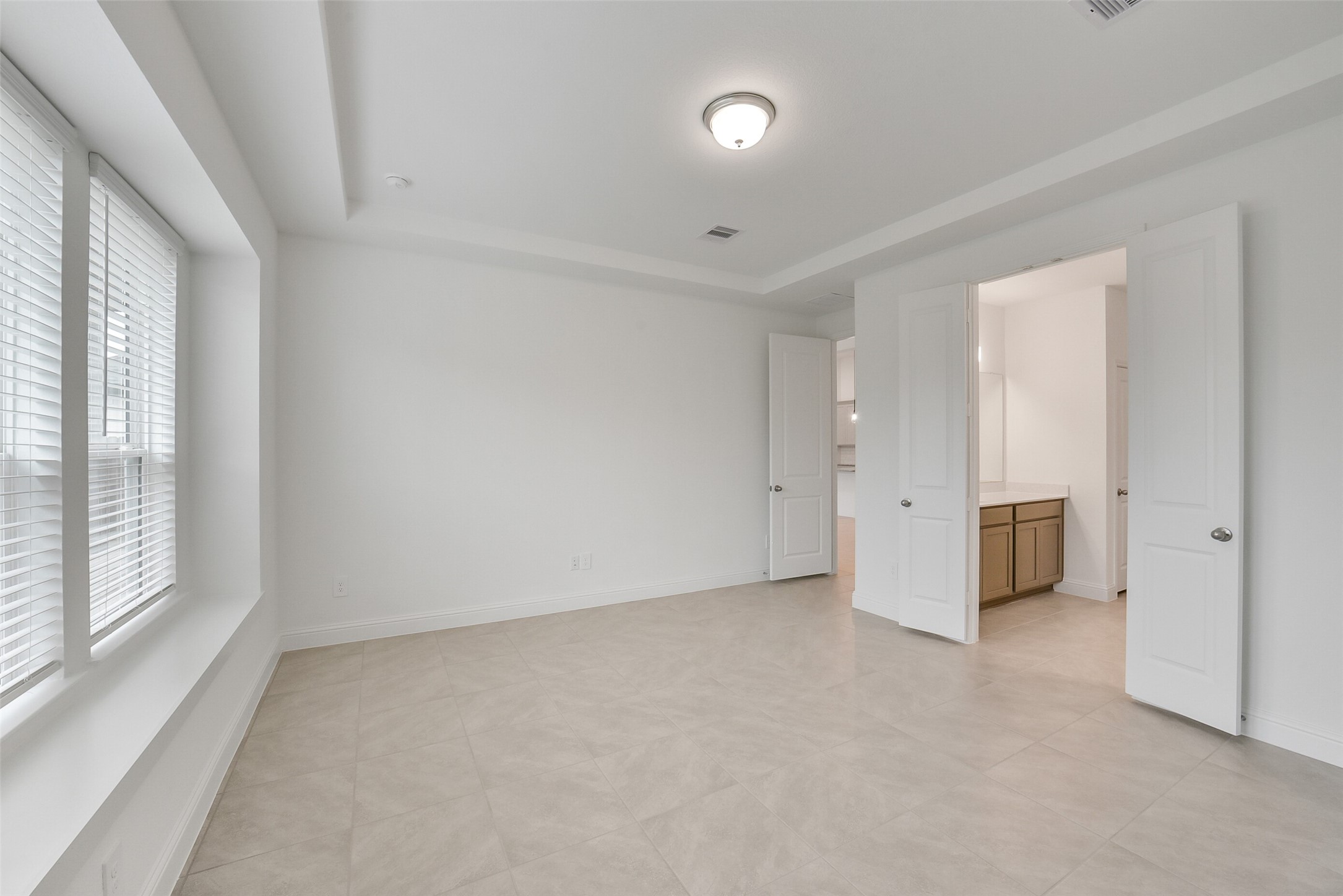 16018 Tangled Vine Lane Conroe, TX 77302 - Photo 21 of 41 a view of an empty room with a window