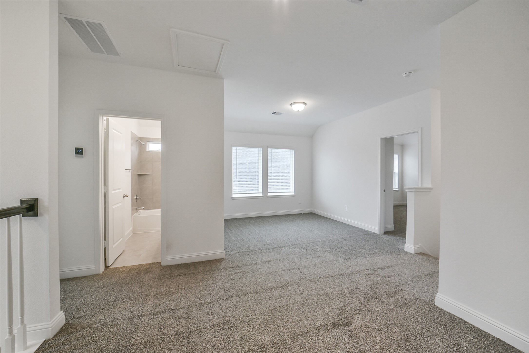 16018 Tangled Vine Lane Conroe, TX 77302 - Photo 31 of 41 an empty room with windows and bathroom