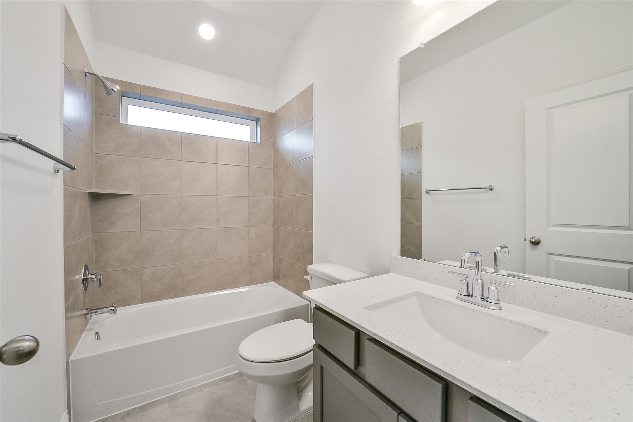 16018 Tangled Vine Lane Conroe, TX 77302 - Photo 36 of 41 a bathroom with a sink a toilet a mirror and bathtub
