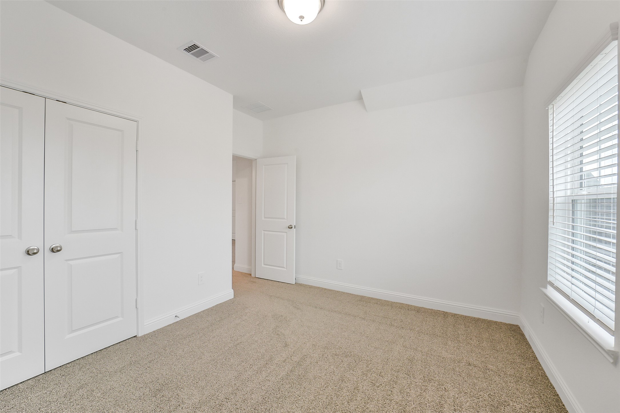 16018 Tangled Vine Lane Conroe, TX 77302 - Photo 38 of 41 a view of an empty room with a window