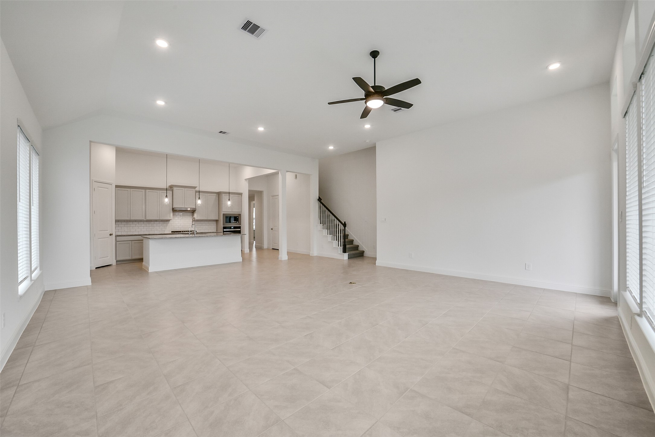 16018 Tangled Vine Lane Conroe, TX 77302 - Photo 10 of 41 a view of a kitchen with a sink and refrigerator