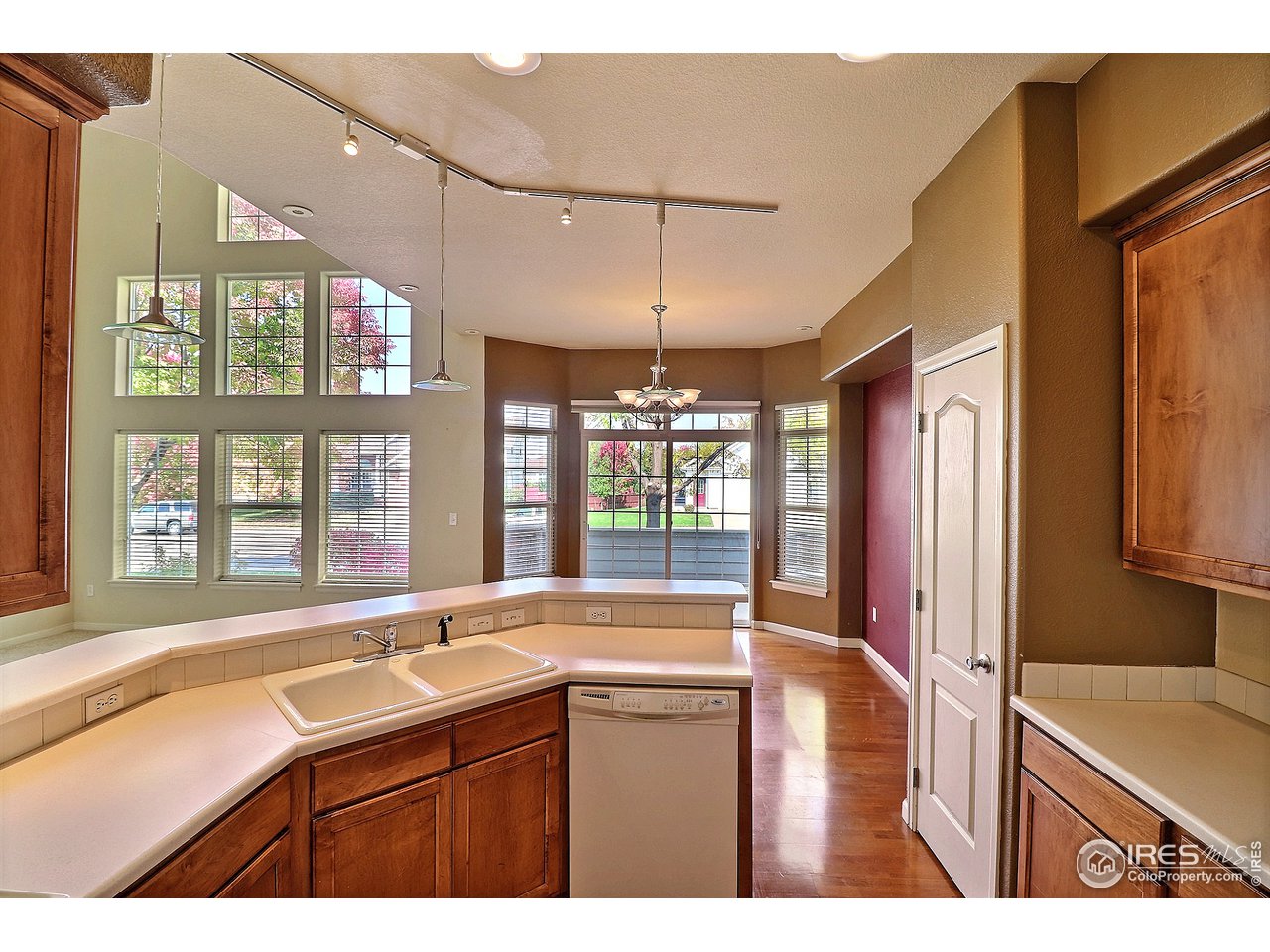 5600 West 3rd Street, Unit 4 Greeley, CO 80634 - Photo 15 of 32 a kitchen view with granite countertop a sink and a large window