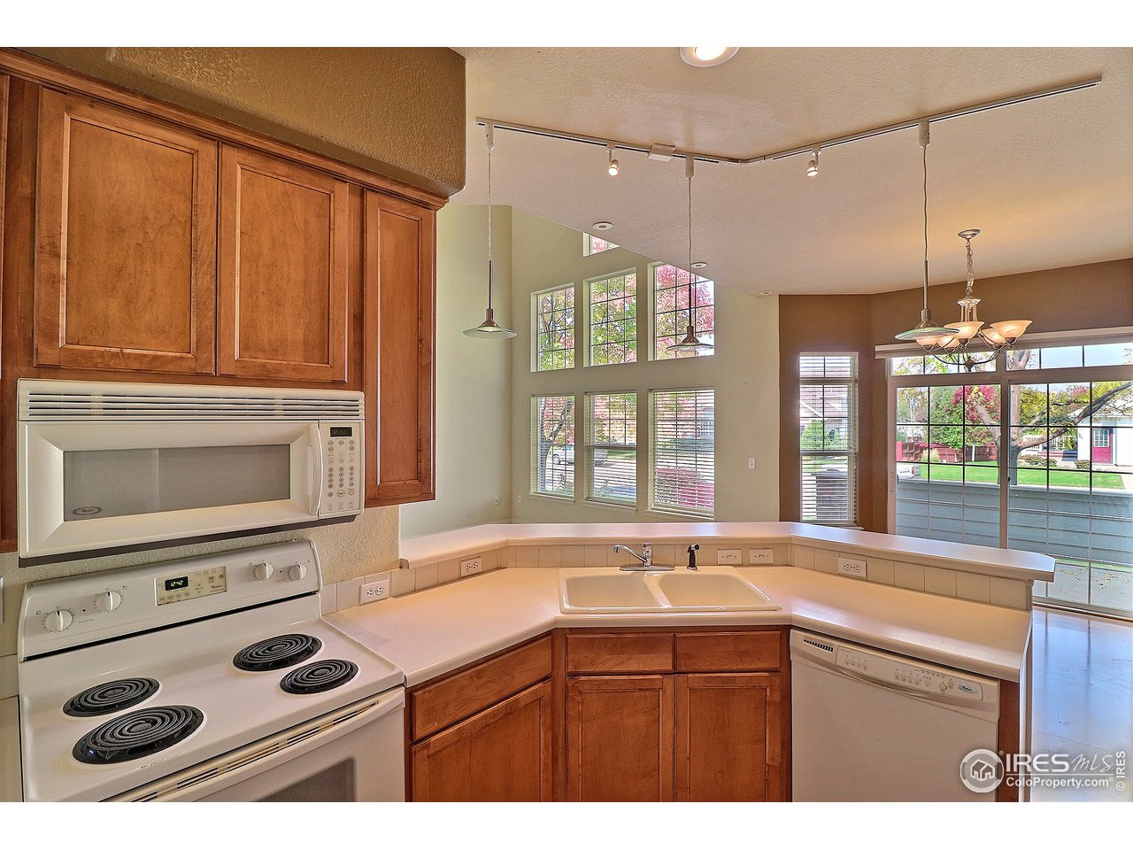 5600 West 3rd Street, Unit 4 Greeley, CO 80634 - Photo 16 of 32 a kitchen with a stove a sink and a microwave