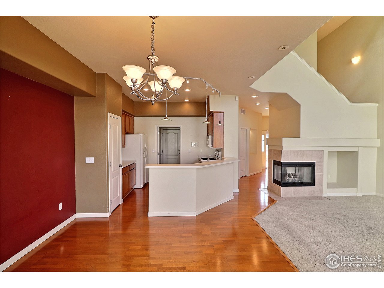 5600 West 3rd Street, Unit 4 Greeley, CO 80634 - Photo 17 of 32 a view of a living room with kitchen island furniture and a chandelier