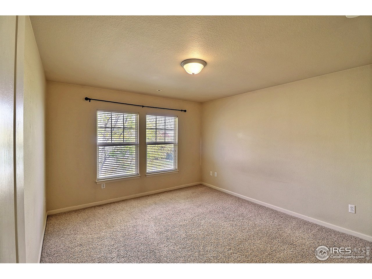 5600 West 3rd Street, Unit 4 Greeley, CO 80634 - Photo 20 of 32 a view of an empty room with a window