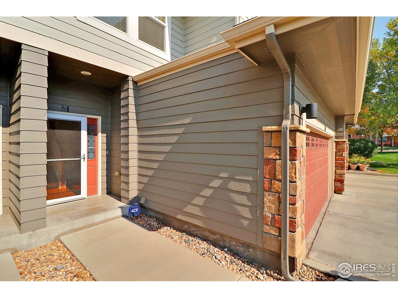 5600 West 3rd Street, Unit 4 Greeley, CO 80634 - Photo 2 of 32 a view of a house with a wooden fence