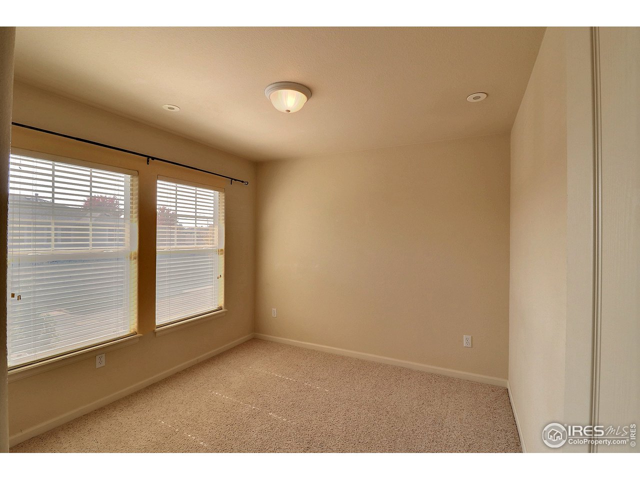 5600 West 3rd Street, Unit 4 Greeley, CO 80634 - Photo 26 of 32 a view of an empty room with a window