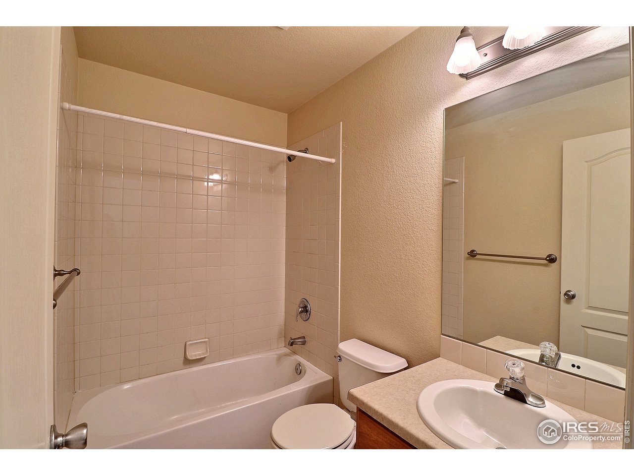 5600 West 3rd Street, Unit 4 Greeley, CO 80634 - Photo 29 of 32 a bathroom with a sink toilet and shower
