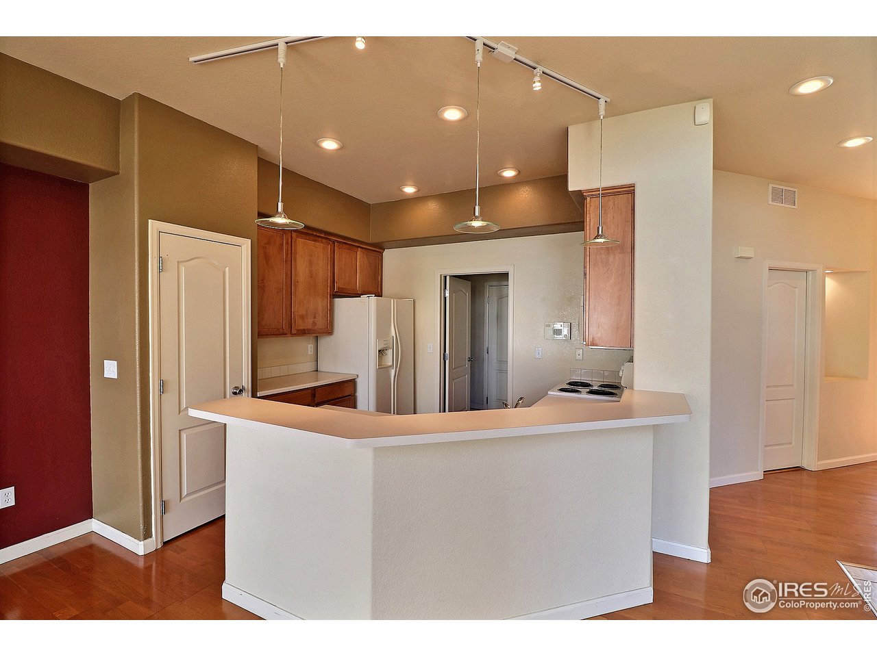 5600 West 3rd Street, Unit 4 Greeley, CO 80634 - Photo 10 of 32 a kitchen with stainless steel appliances kitchen island granite countertop a refrigerator and a sink