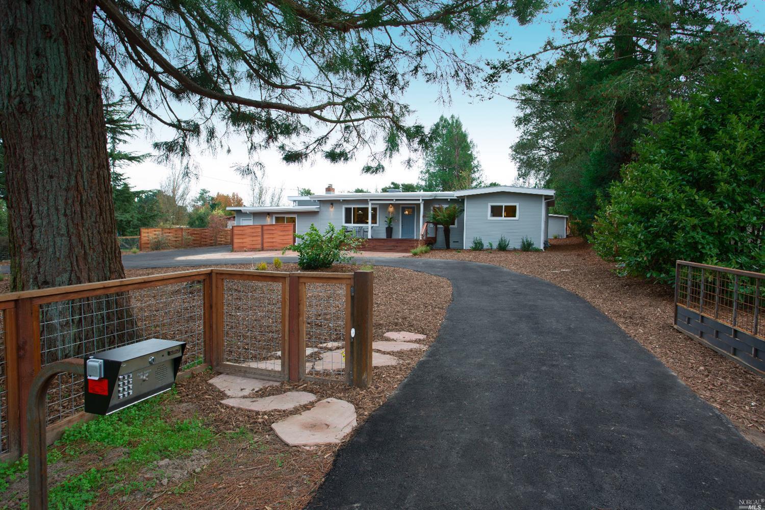 1477 Bloomfield Road Sebastopol, CA 95472 - Photo 1 of 1 a view of a patio with table and chairs potted plants and large tree