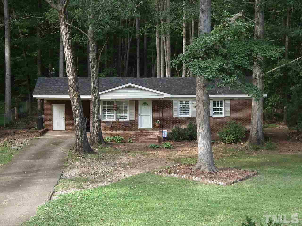 2824 Oak Ridge Court Raleigh, NC 27603 - Photo 1 of 22 a front view of a house with a yard