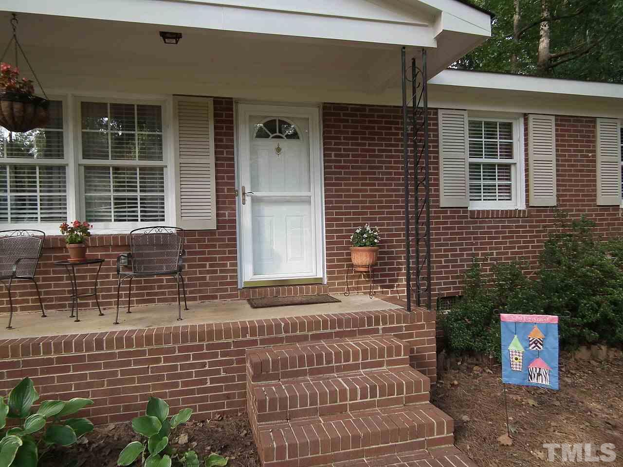 2824 Oak Ridge Court Raleigh, NC 27603 - Photo 18 of 22 a front view of a house with a garage