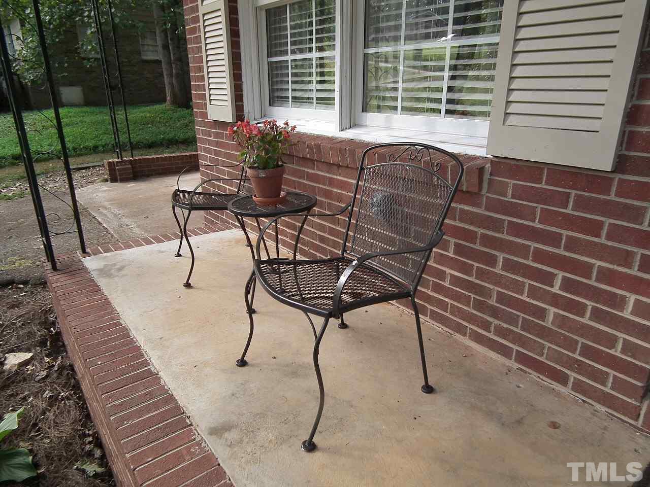 2824 Oak Ridge Court Raleigh, NC 27603 - Photo 19 of 22 a patio with table and chairs
