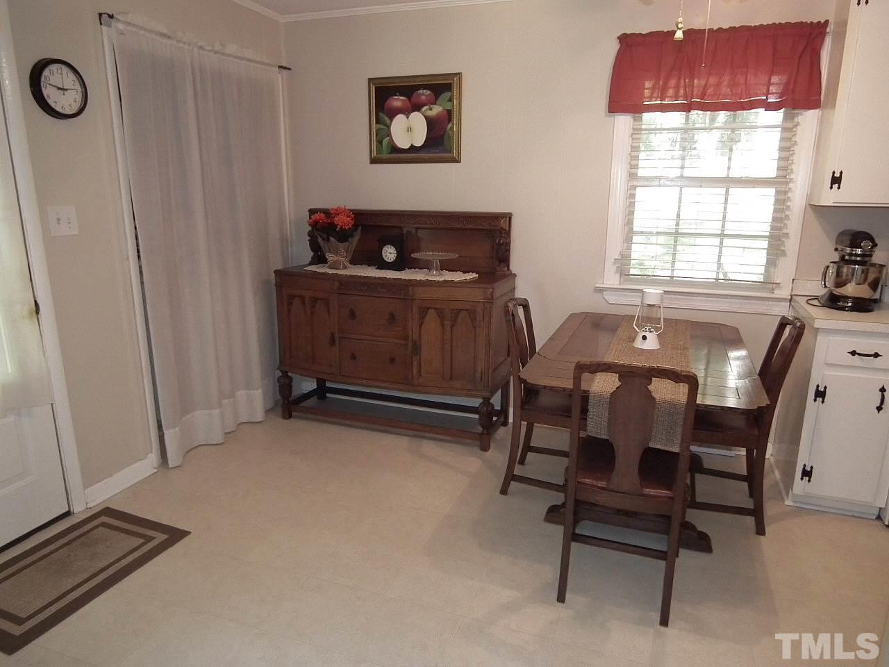 2824 Oak Ridge Court Raleigh, NC 27603 - Photo 5 of 22 a workspace with furniture and window