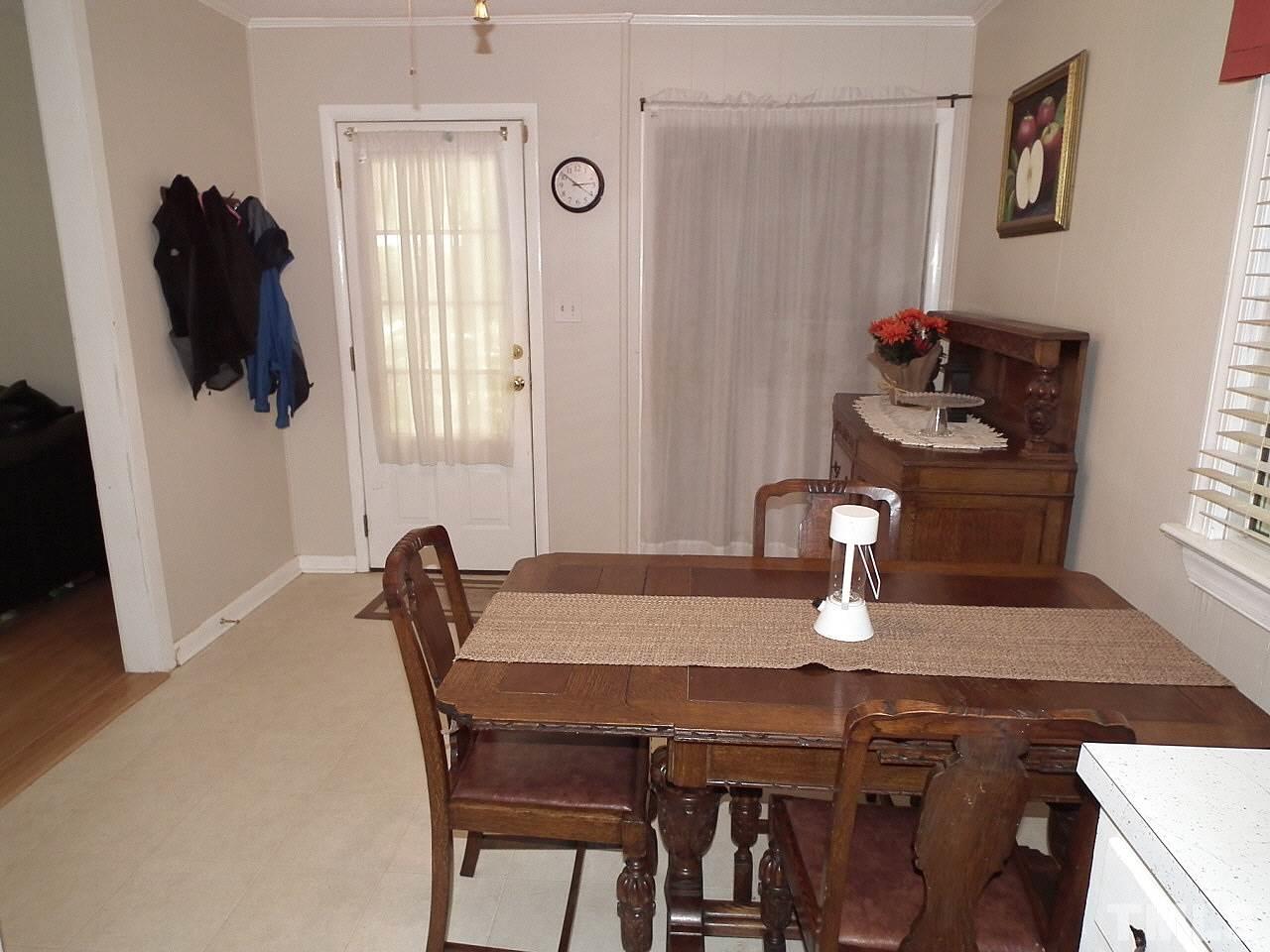 2824 Oak Ridge Court Raleigh, NC 27603 - Photo 6 of 22 a dining room with furniture and window