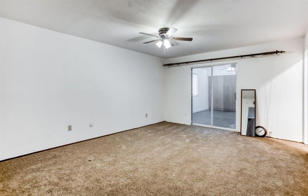5656 Pearce Street The Colony, TX 75056 - Photo 13 of 23 an empty room with closet and a chandelier fan