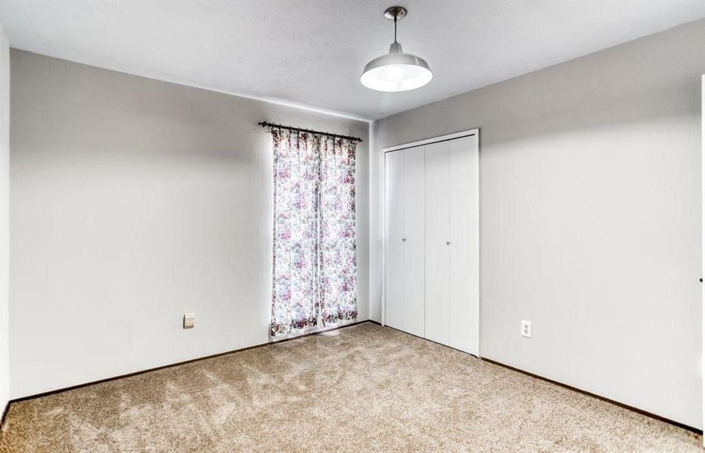 5656 Pearce Street The Colony, TX 75056 - Photo 9 of 23 a view of empty room with window