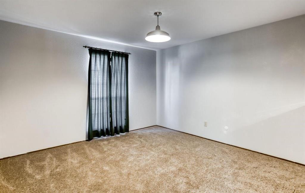 5656 Pearce Street The Colony, TX 75056 - Photo 10 of 23 a view of an empty room with a window