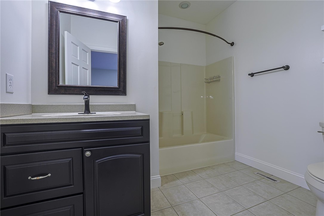 3681 Wilmington Road Lebanon, OH 45036 - Photo 36 of 87 This bright bathroom features a vanity, bathtub with shower, and tiled flooring.