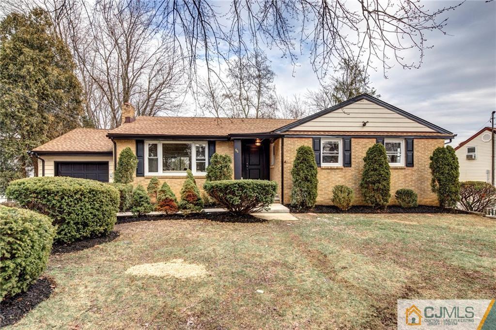 66 Middlesex Road Matawan, NJ 07747 - Photo 1 of 22 a front view of a house with a garden