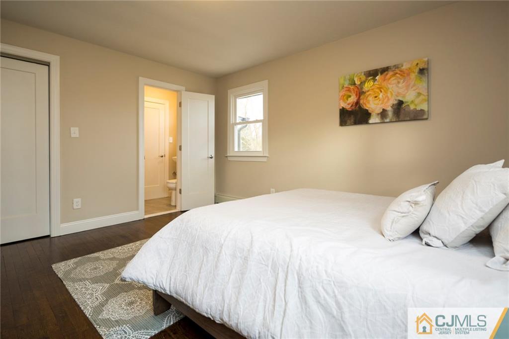 66 Middlesex Road Matawan, NJ 07747 - Photo 17 of 22 a bedroom with a bed and wooden floor