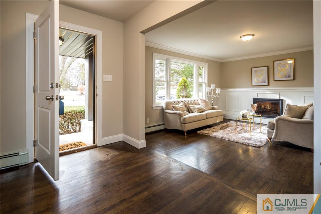 66 Middlesex Road Matawan, NJ 07747 - Photo 3 of 22 a living room with furniture and a large window