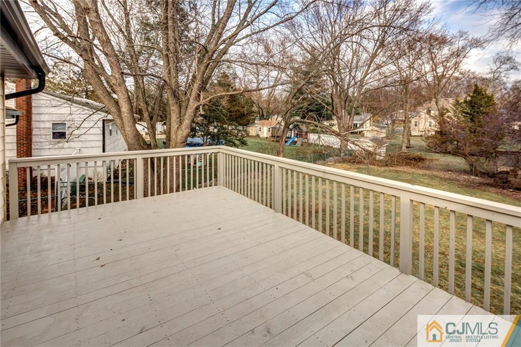 66 Middlesex Road Matawan, NJ 07747 - Photo 22 of 22 a view of a balcony with wooden fence
