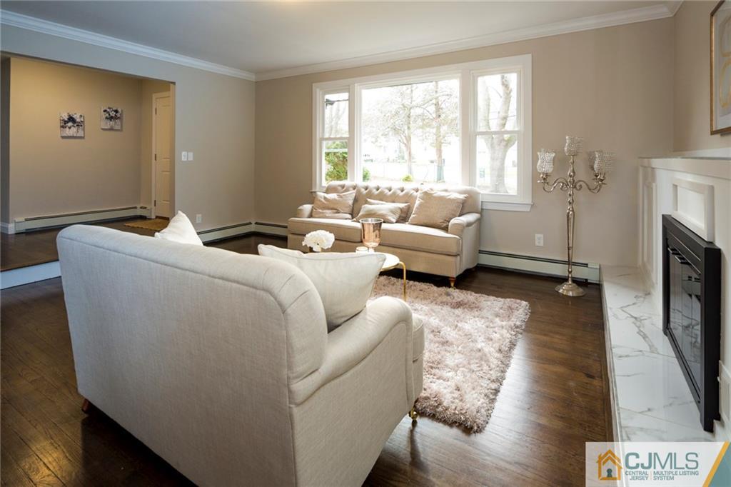 66 Middlesex Road Matawan, NJ 07747 - Photo 4 of 22 a living room with furniture and a fireplace