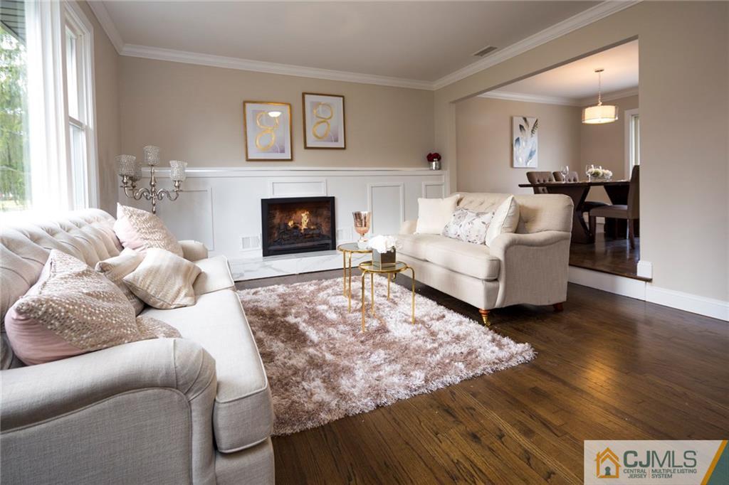 66 Middlesex Road Matawan, NJ 07747 - Photo 5 of 22 a living room with furniture and a fireplace