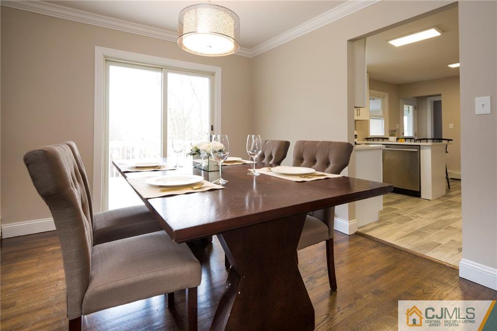 66 Middlesex Road Matawan, NJ 07747 - Photo 7 of 22 a view of a dining room with furniture and wooden floor