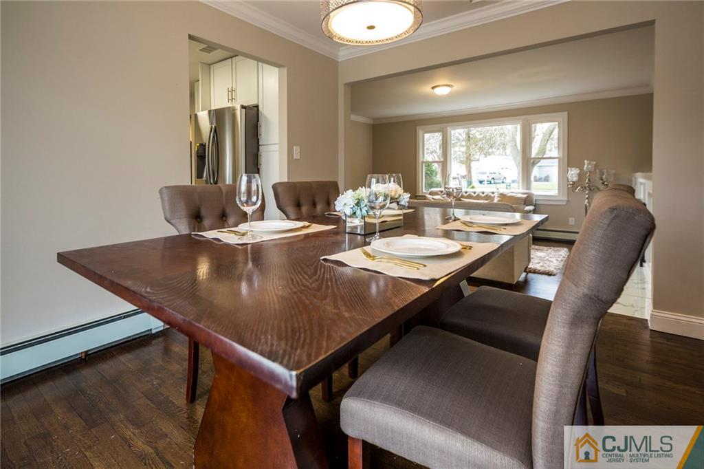66 Middlesex Road Matawan, NJ 07747 - Photo 8 of 22 a view of a dining room with furniture and wooden floor