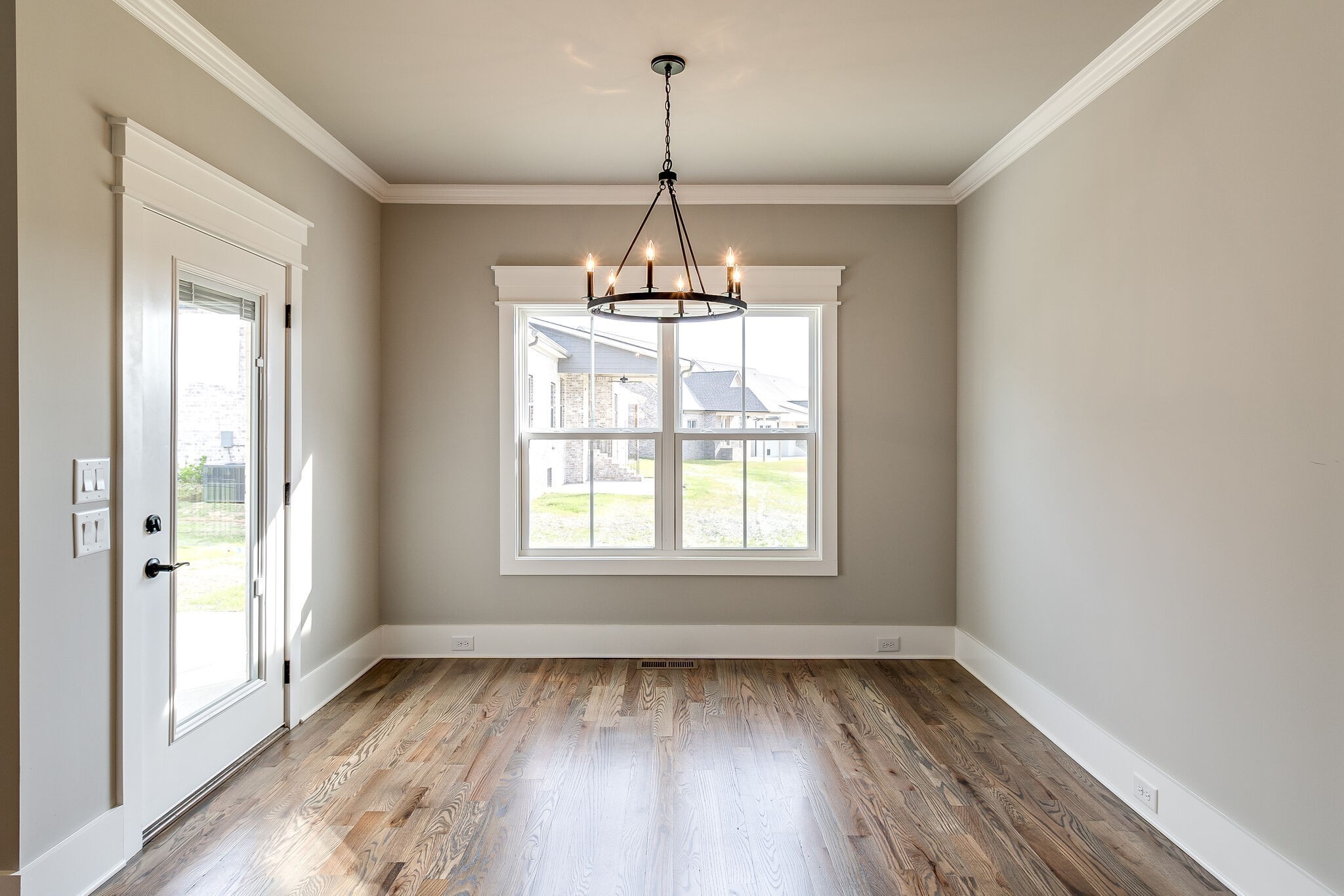 3003 Turnstone Trace Spring Hill, TN 37174 - Photo 11 of 26 a view of an empty room with wooden floor and a window