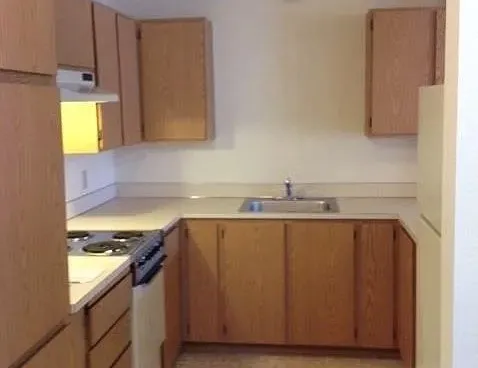 a view of a kitchen with a sink and a dishwasher