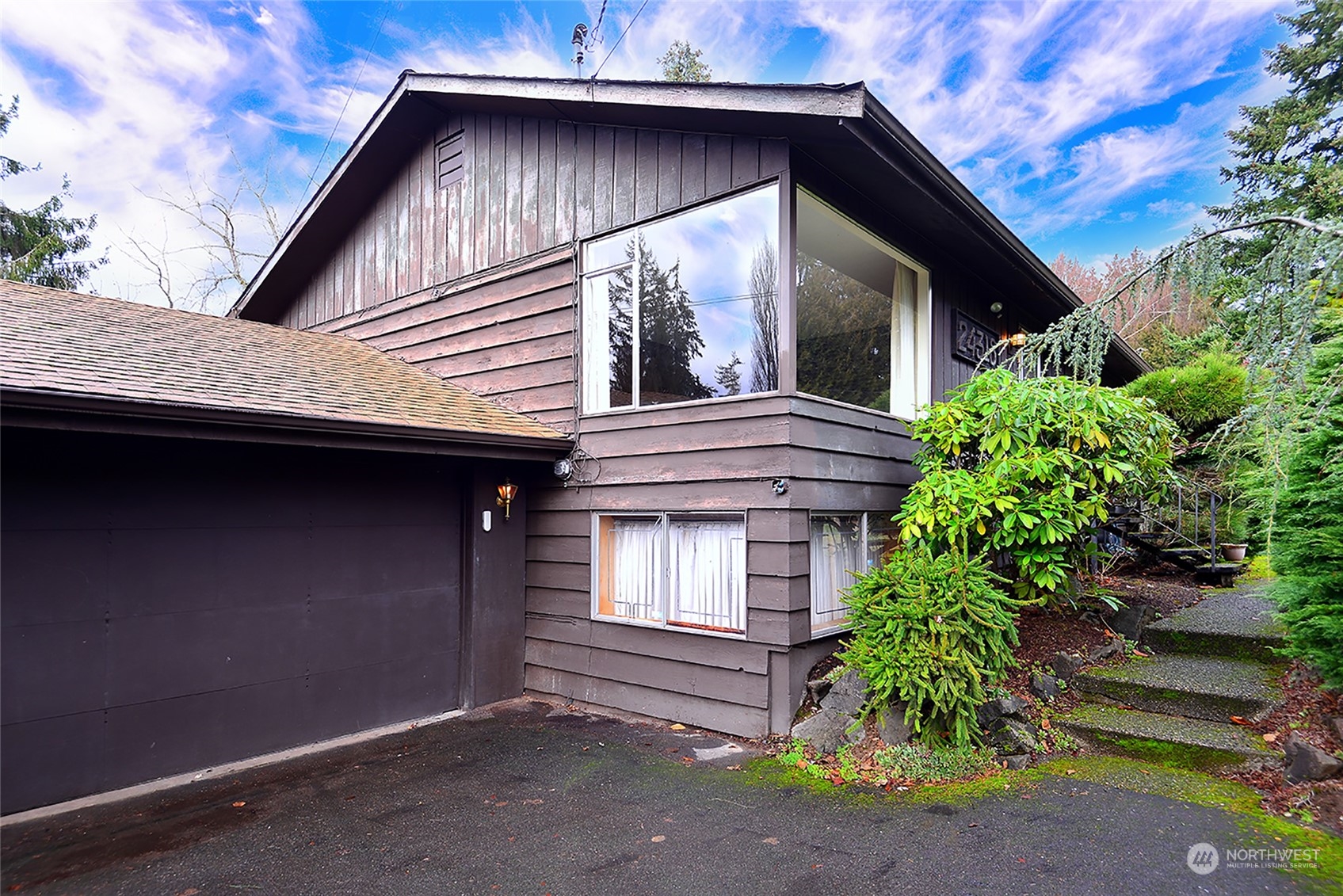 24318 7th Avenue West Bothell, WA 98021 - Photo 2 of 19 a front view of a house with garden