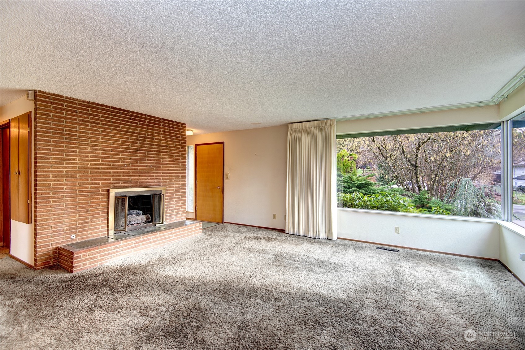 24318 7th Avenue West Bothell, WA 98021 - Photo 3 of 19 a view of empty room with a fireplace