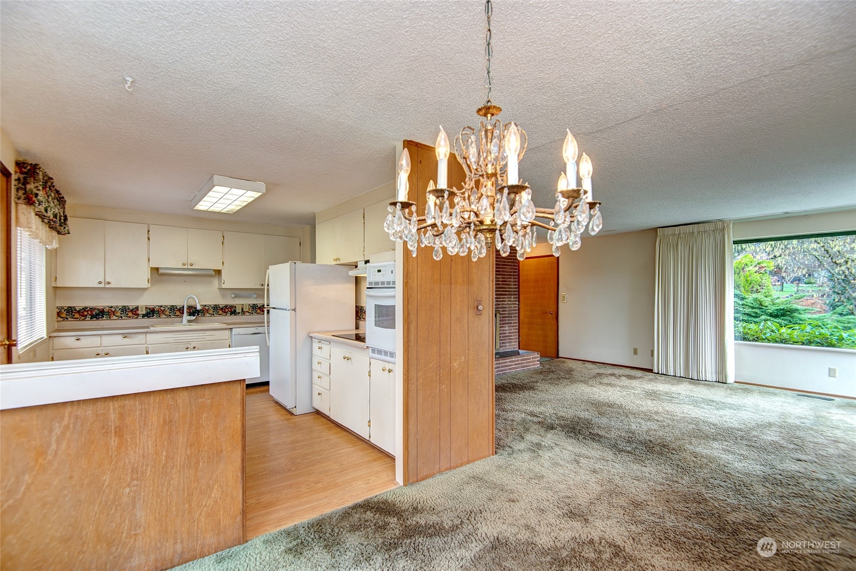 24318 7th Avenue West Bothell, WA 98021 - Photo 4 of 19 a view of a kitchen with a sink stove and refrigerator